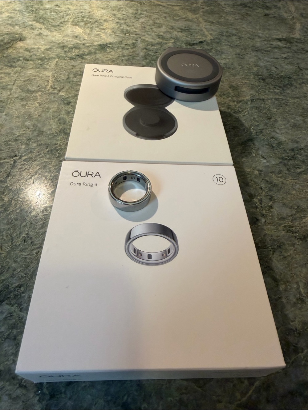 Oura ring 4 size 10 in silver with charging cord PLUS portable charging case.